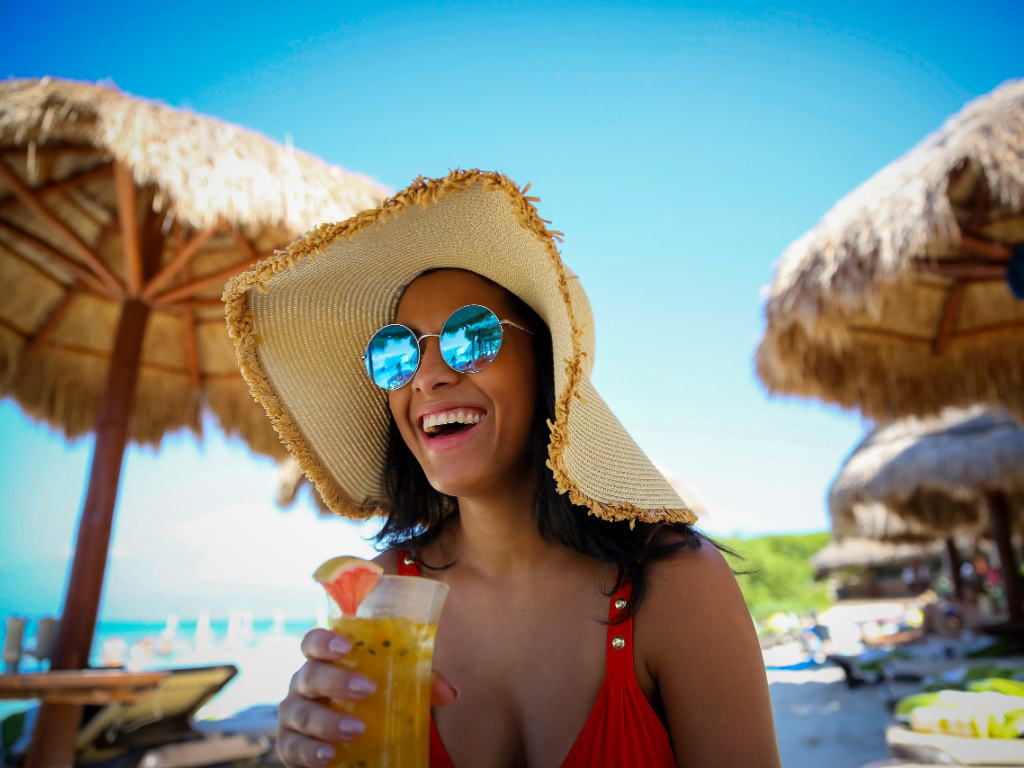 Lady with a cocktail on the beach
