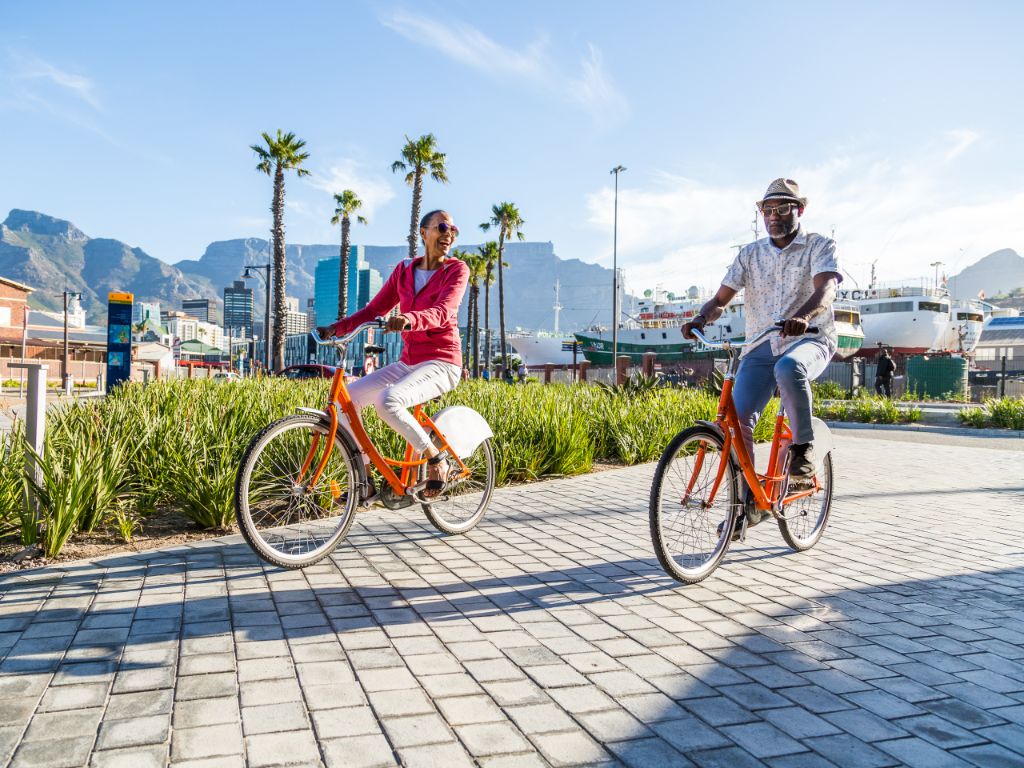 Couple on bikes on the waterfront