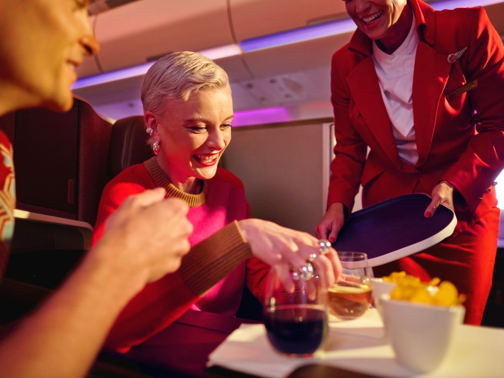 Lady on board being served food and drink