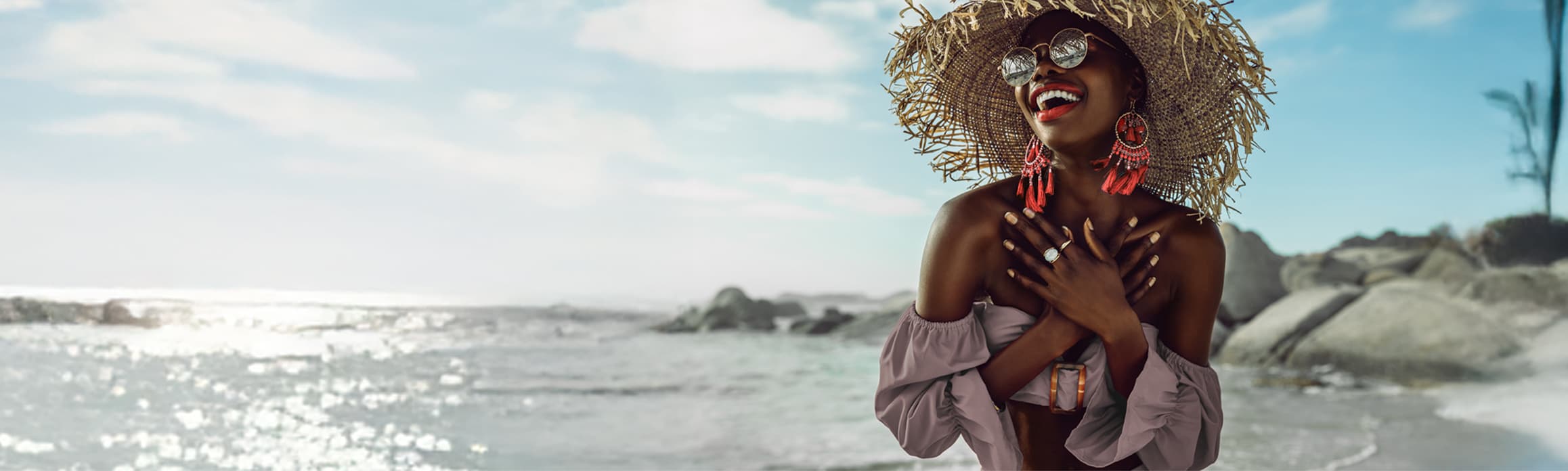 Lady in straw hat on the beach