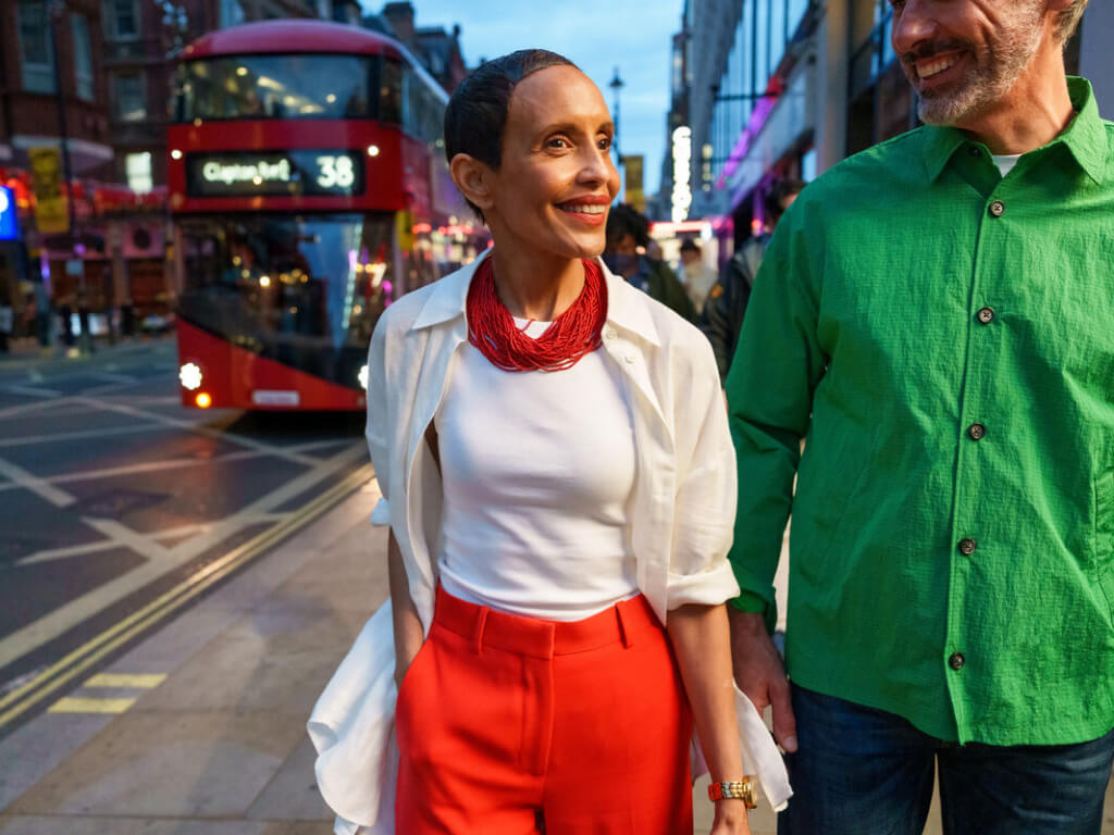 Couple walk hand in hand through London