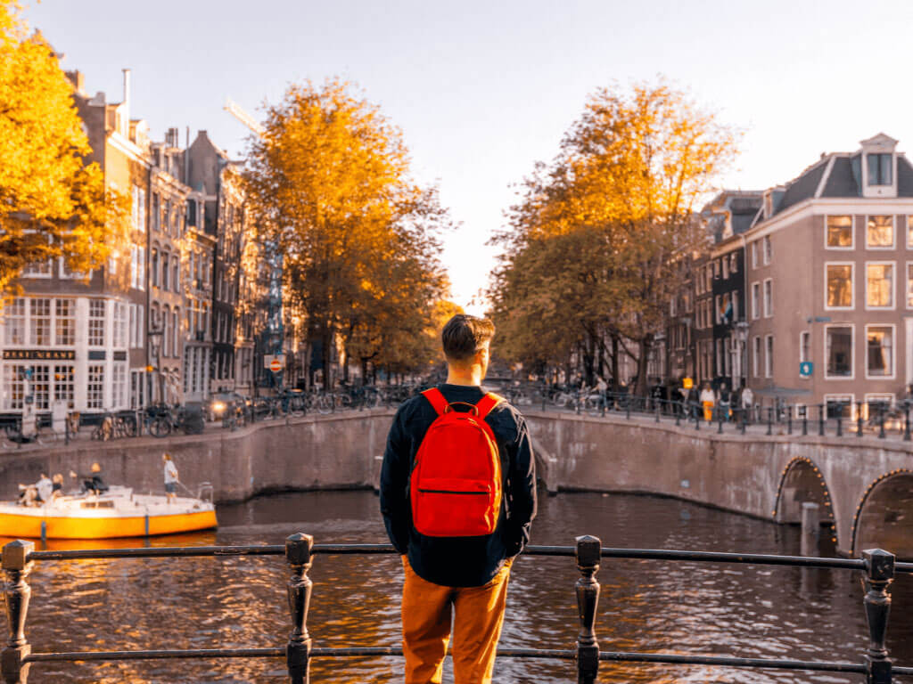 Man by the river in Amsterdam