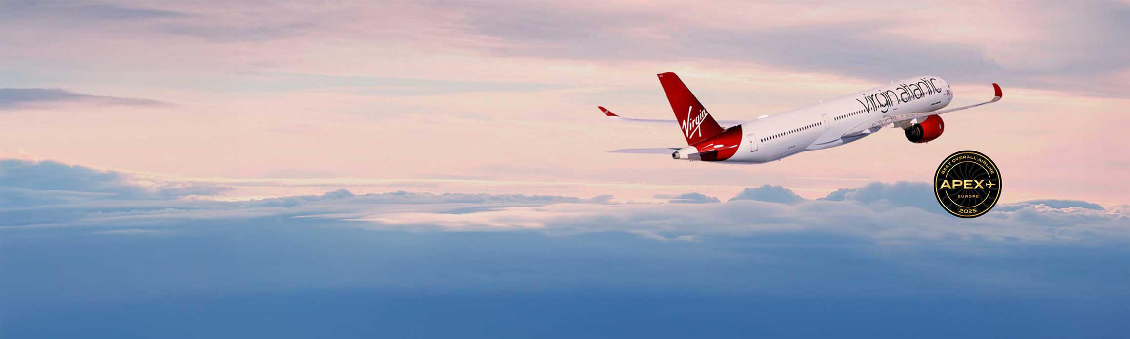 Virgin Atlantic plane flying into the sunset