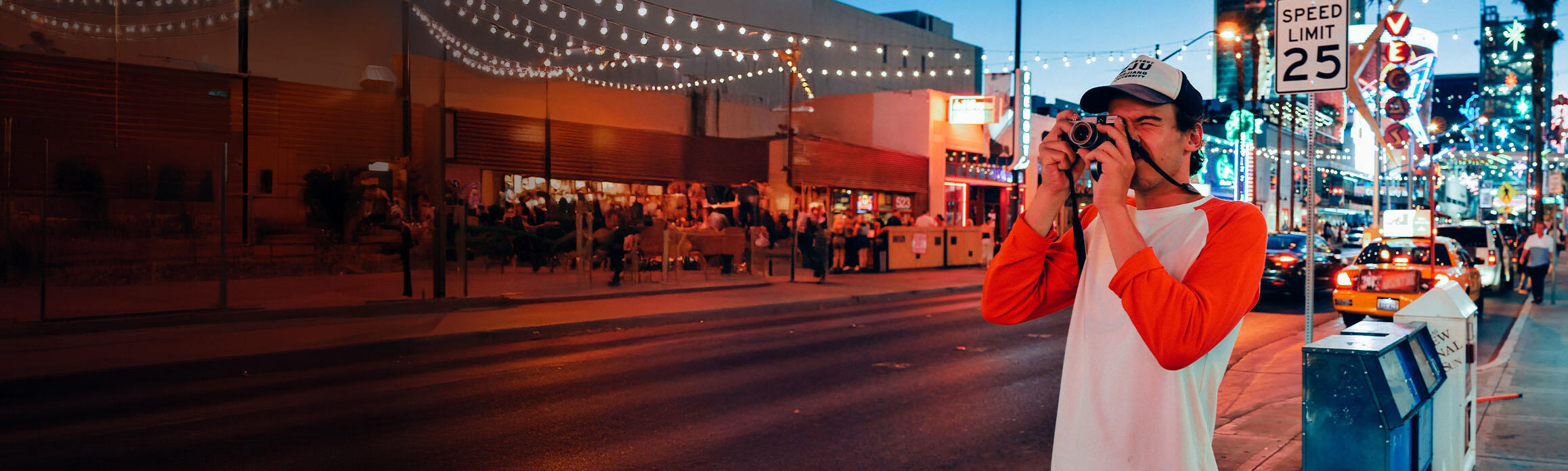 Man taking a photo on a road in Vegas