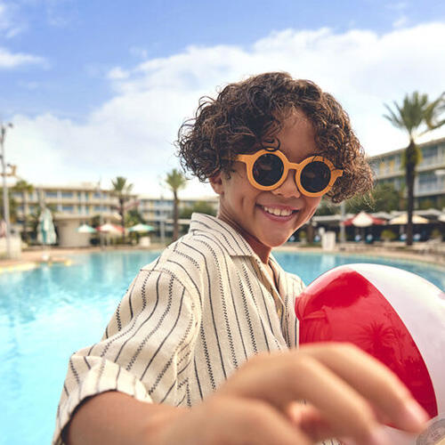 Boy by the pool