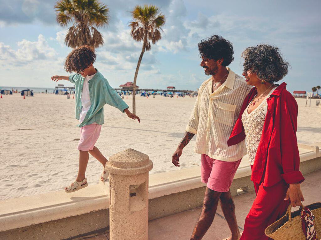 Family walking along the beach in Florida