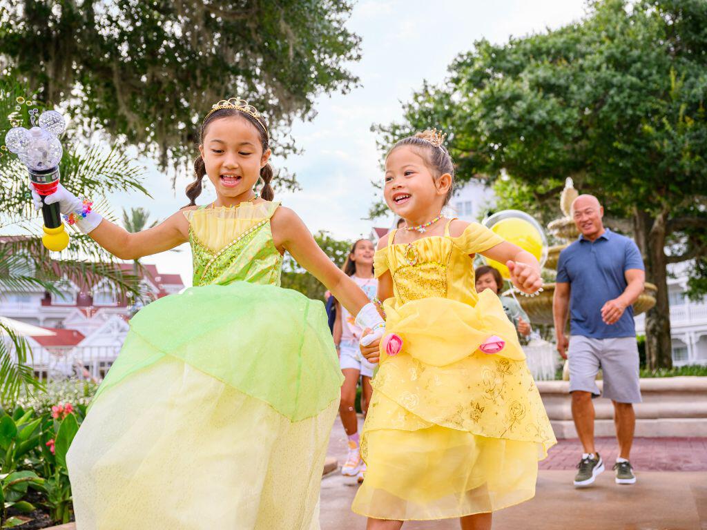 Two girls at Disney in princess dresses