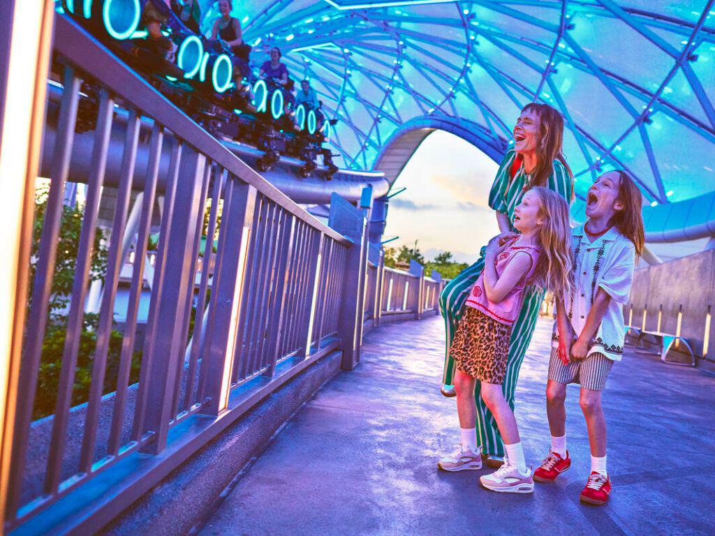 Family waiting to ride on Tron