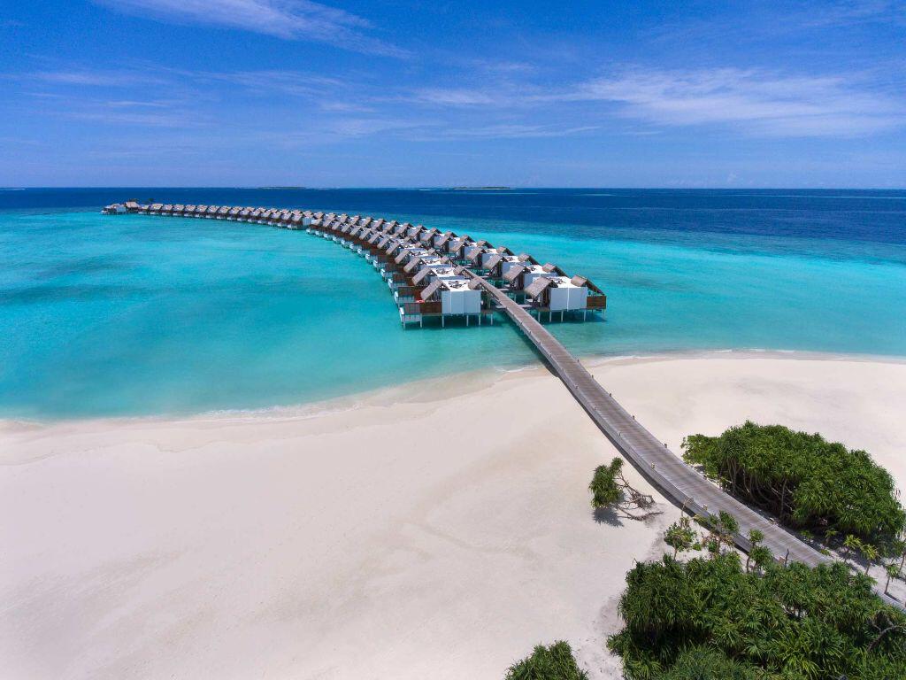 Couple walking hand in hand, Maldives