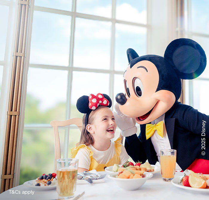 Girl dining with Mickey