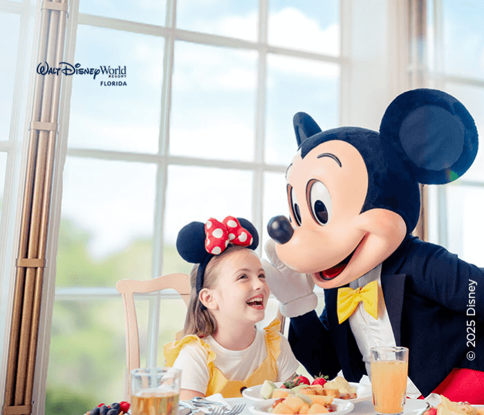 Mickey and girl dining