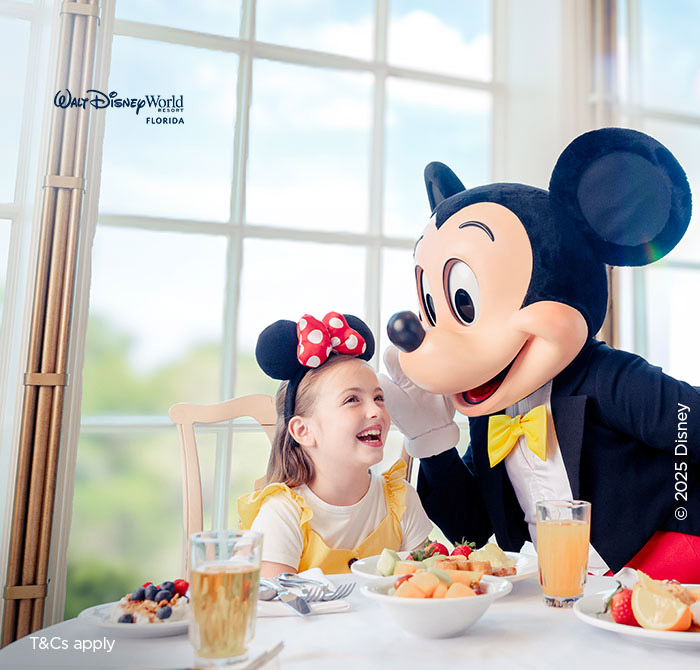 Mickey Mouse with girl dining