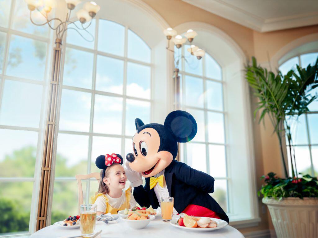 Mickey dining with a girl