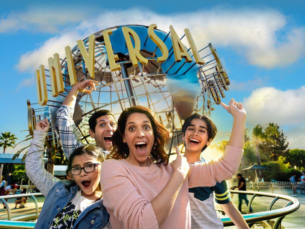Family in front of the Universal globe