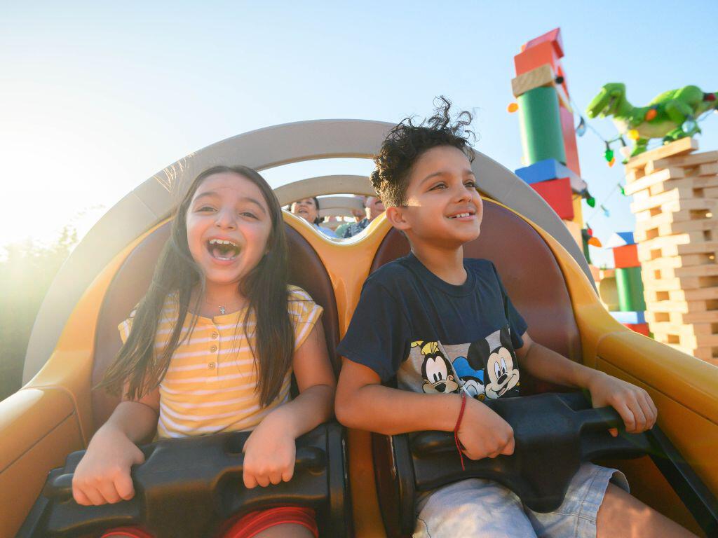 Kids on slinky ride at Disney