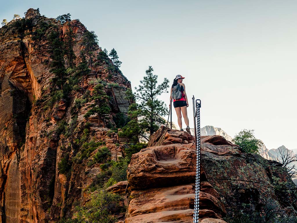 A lady hiking overlooking Zion Park 