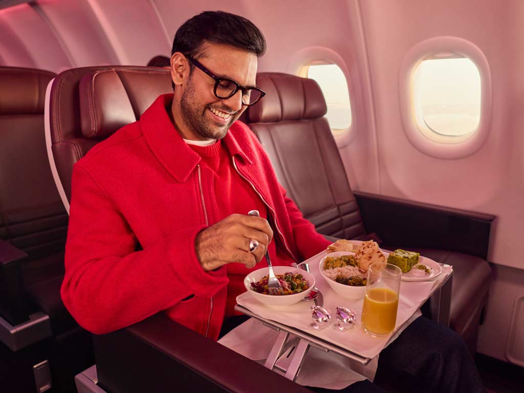Man dining in Premium