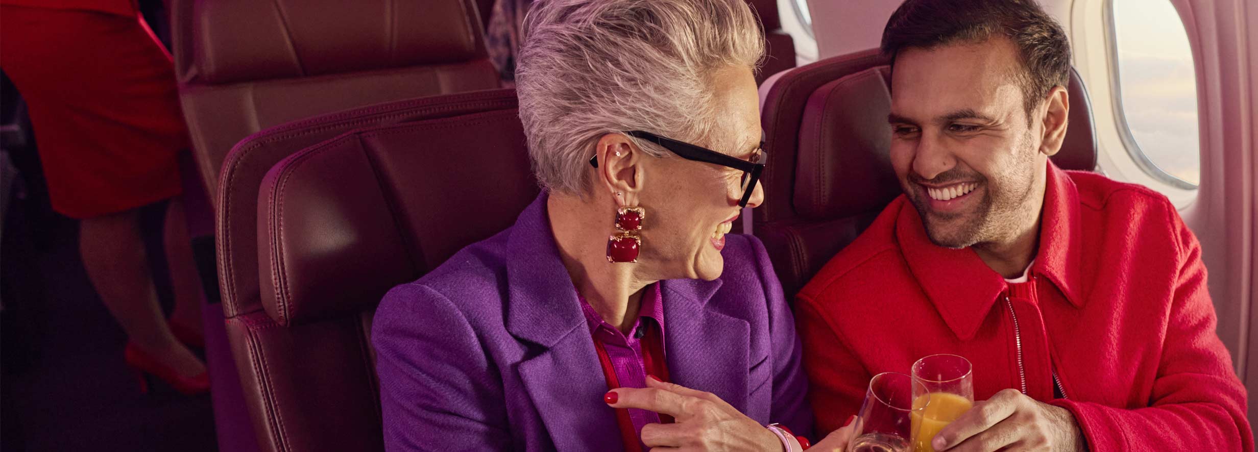 Couple in Premium seats having a drink together