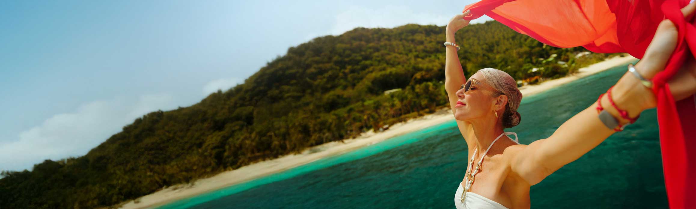 Lady on beach with red scarf
