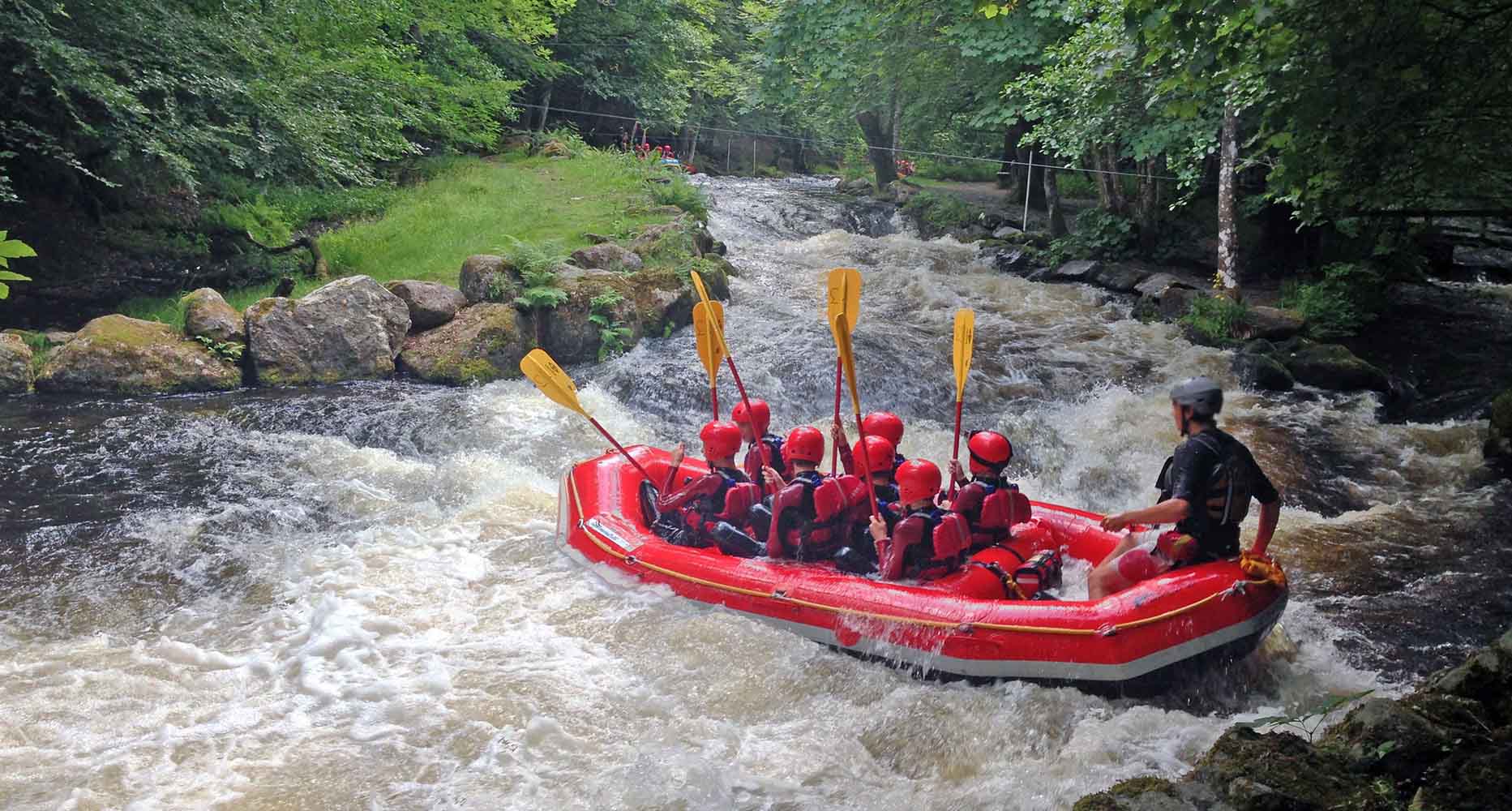 A woman looks out at a river from a boat