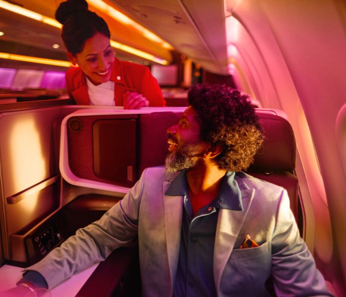 Man in an Upper Class seat onboard