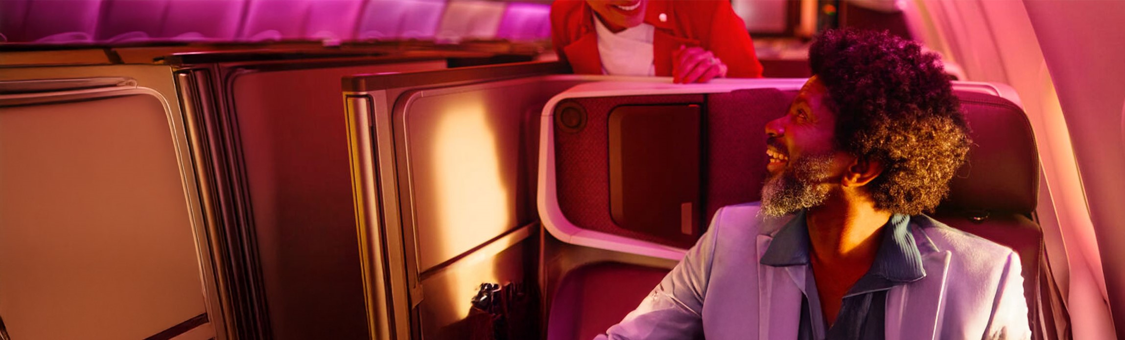 Man in an Upper Class seat onboard