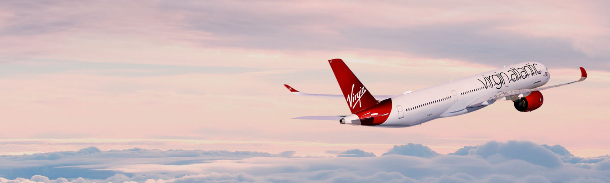 Virgin Atlantic airline staff walking through T3 at Heathrow