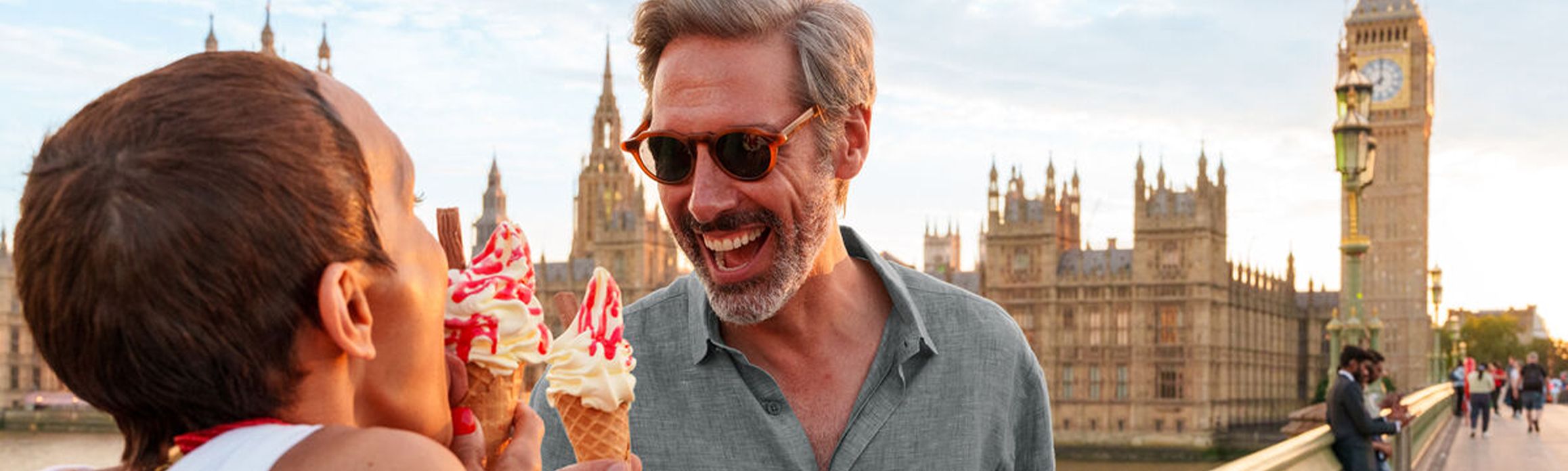 Couple eating ice cream on Westminster Bridge in London