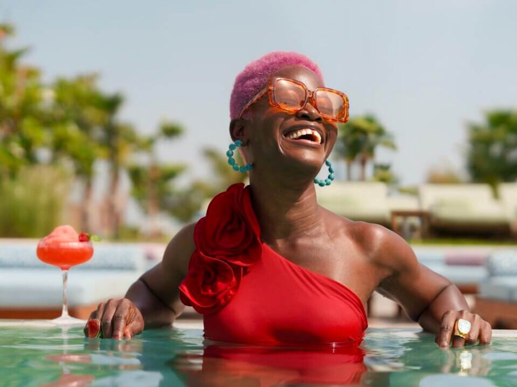 Lady in pool with a cocktail