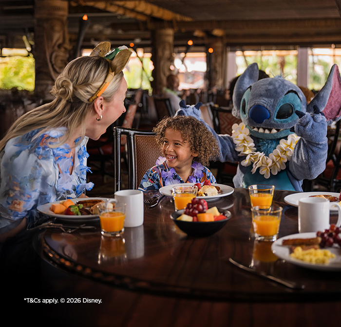 Mum and child having character breakfast with Lilo and Stitch