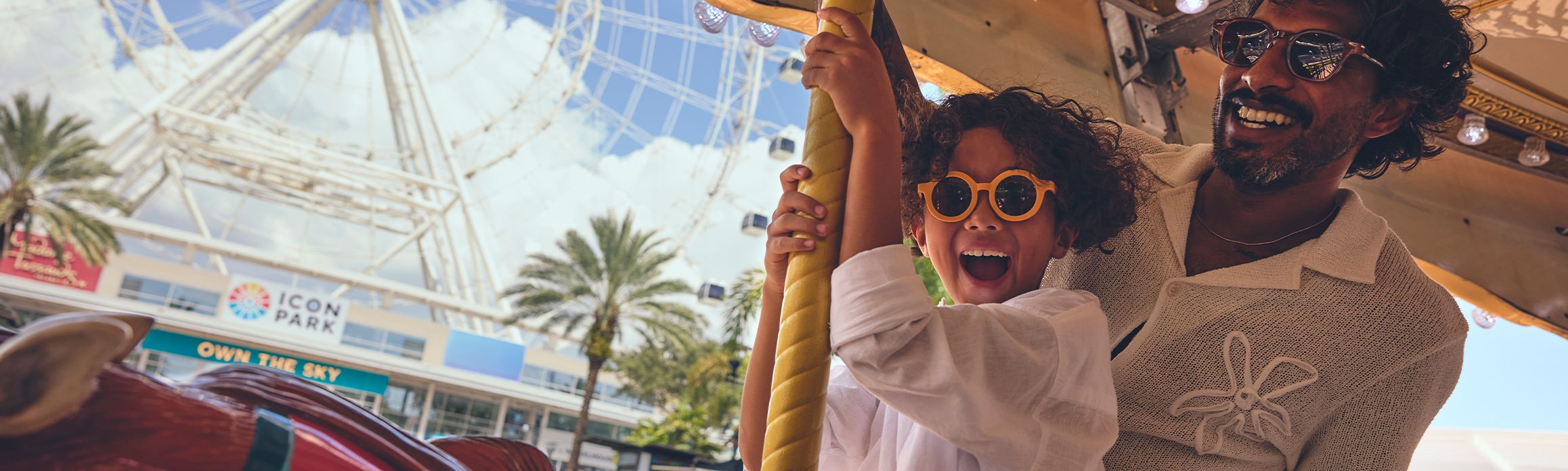 Father and son on carousel in Orlando