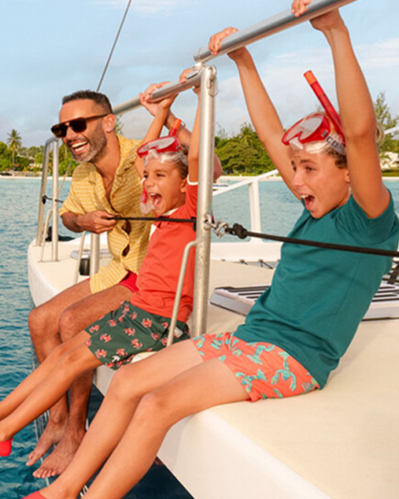 Family on boat in the sea, Barbados
