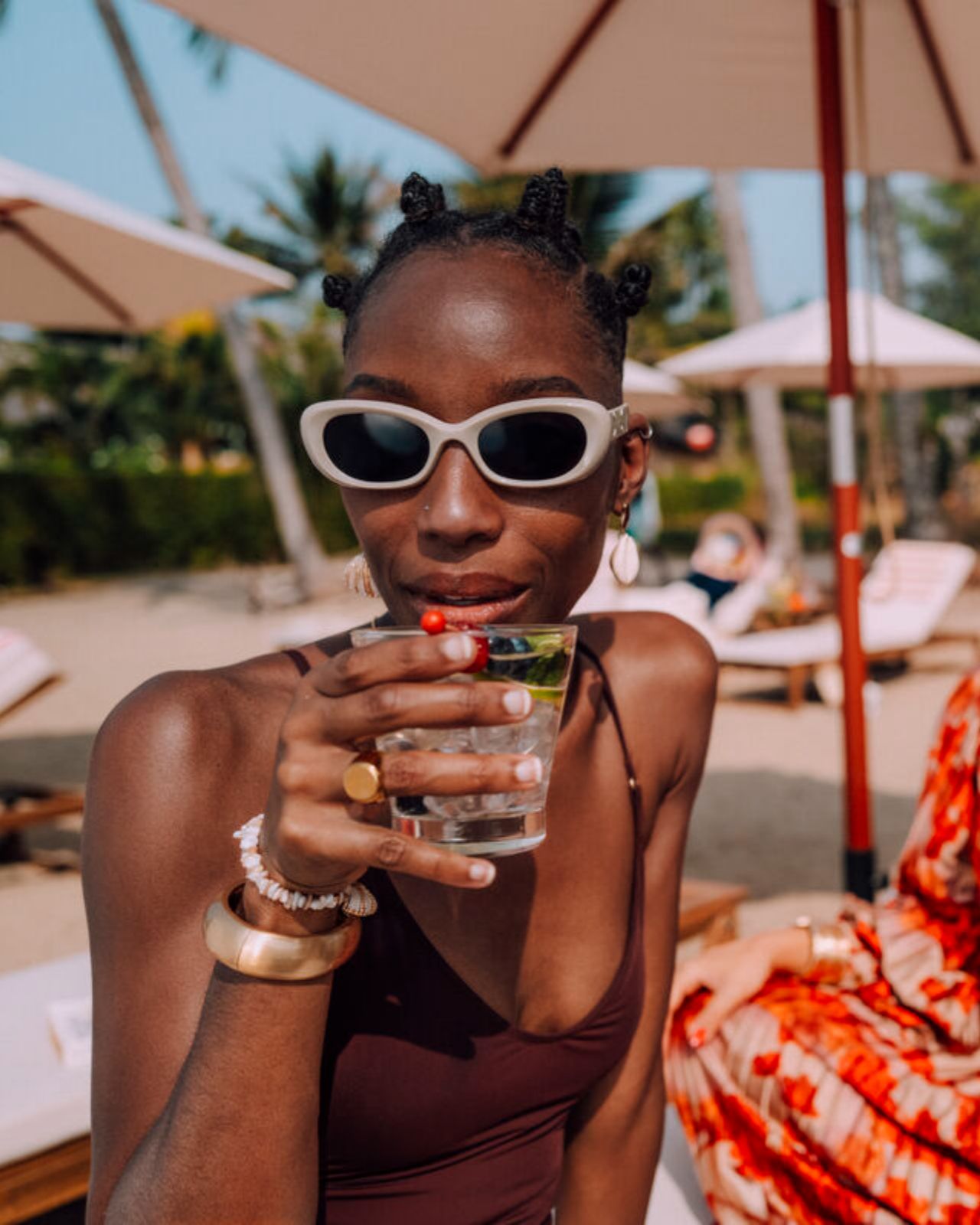 Friends drinking on the beach