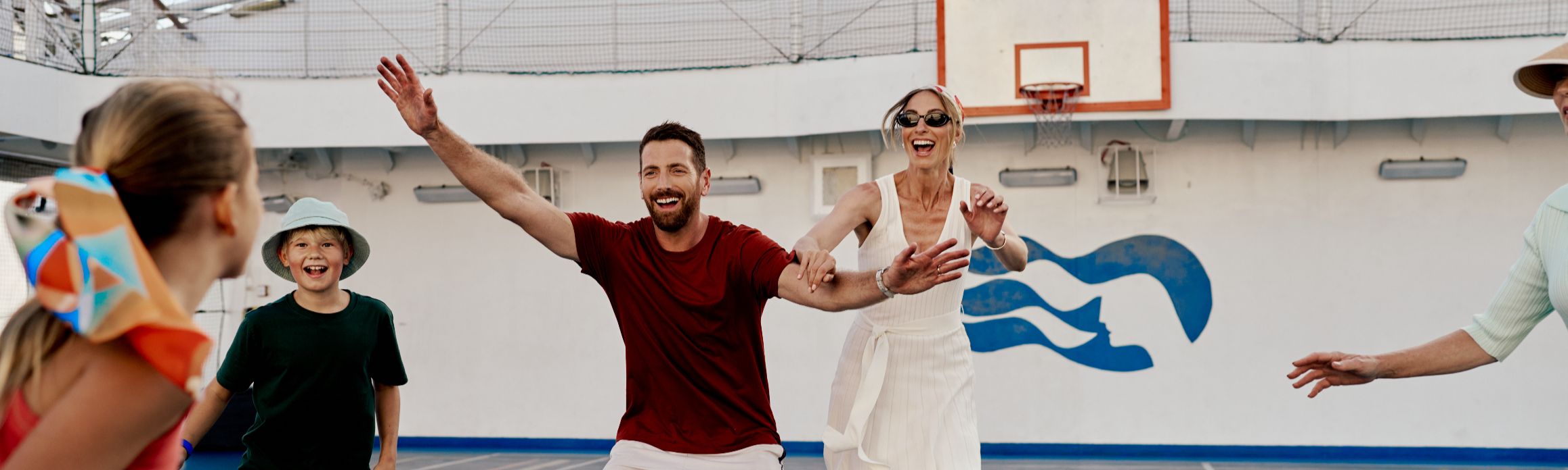 Family playing basketball on board