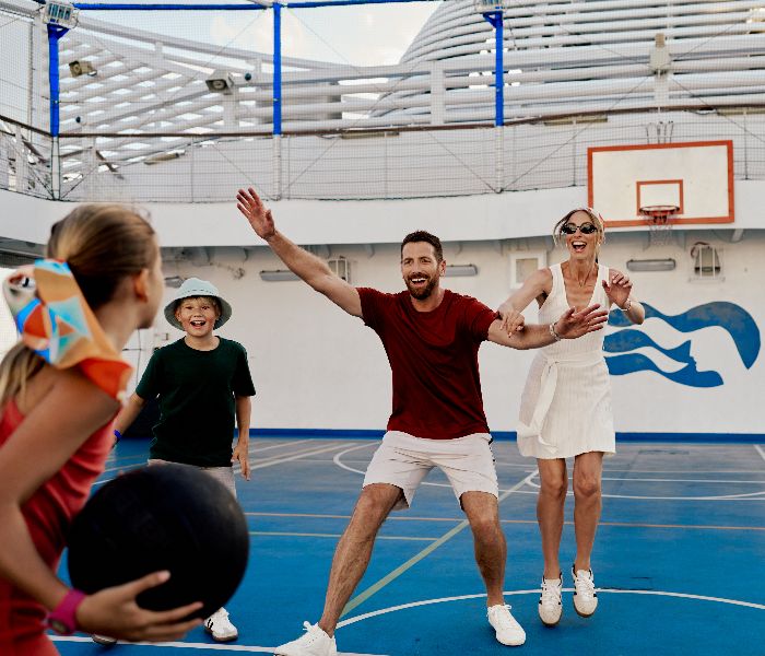 Family playing basketball on board