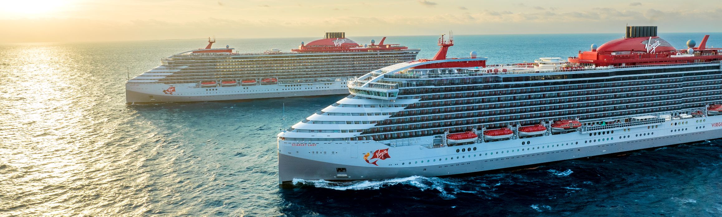 Scarlet Lady and Valiant Lady at sea