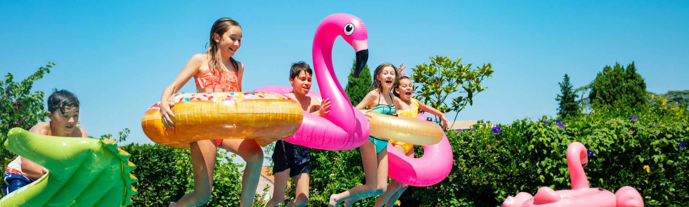 Kids jumping in the pool