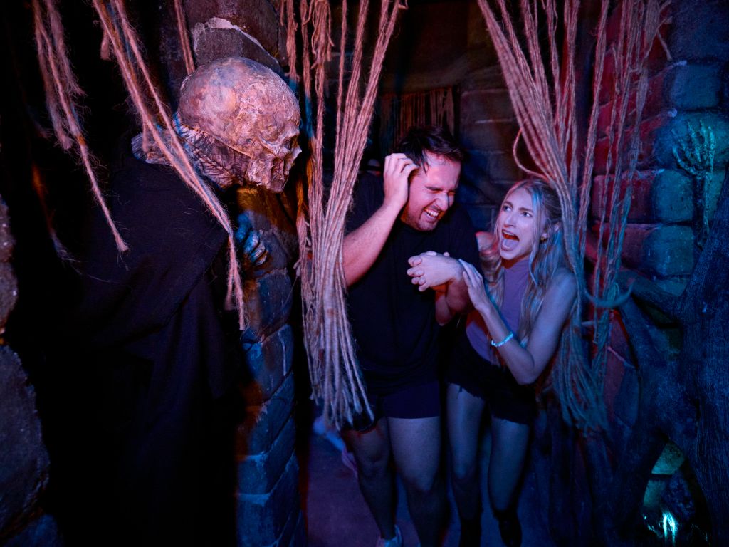 Guests in a scare zone at Halloween Horror Nights