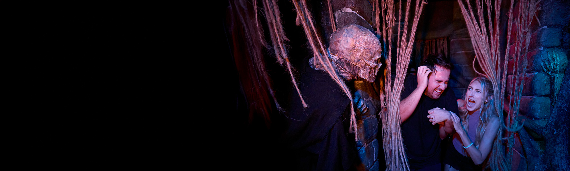 Guests in a scare zone at Halloween Horror Nights