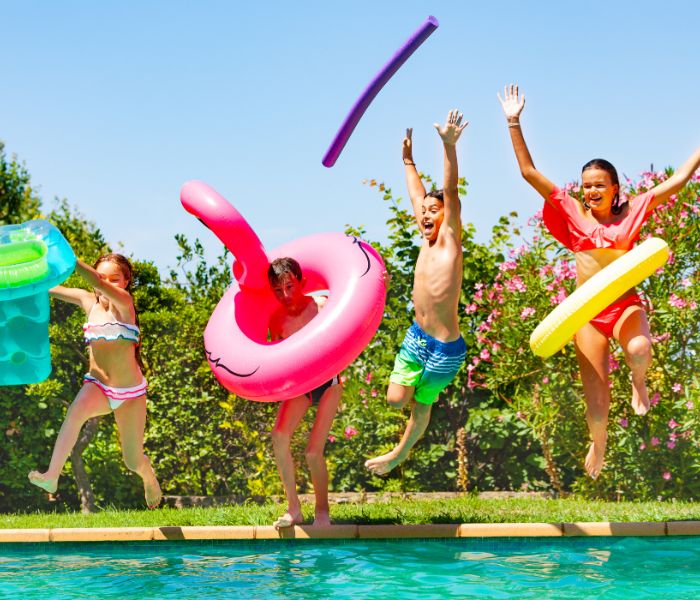 Kids jumping in the pool